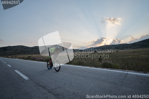 Image of triathlon athlete riding bike