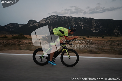 Image of triathlon athlete riding bike