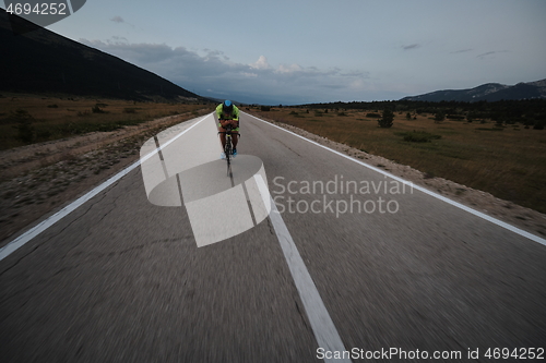 Image of triathlon athlete riding bike