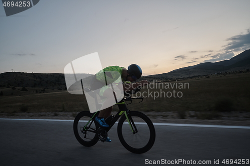 Image of triathlon athlete riding bike