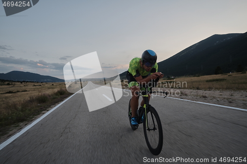 Image of triathlon athlete riding bike