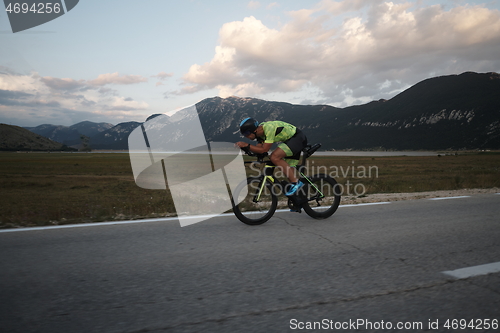 Image of triathlon athlete riding bike