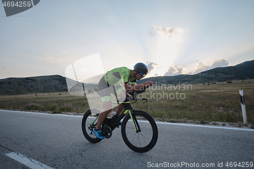 Image of triathlon athlete riding bike