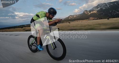 Image of triathlon athlete riding bike