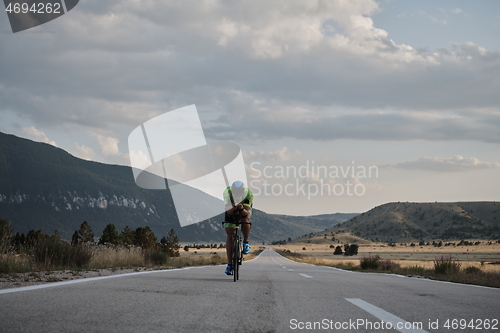 Image of triathlon athlete riding bike