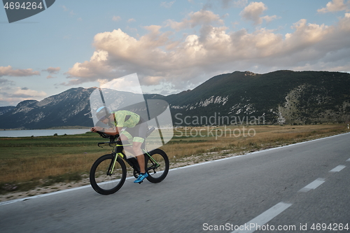 Image of triathlon athlete riding bike