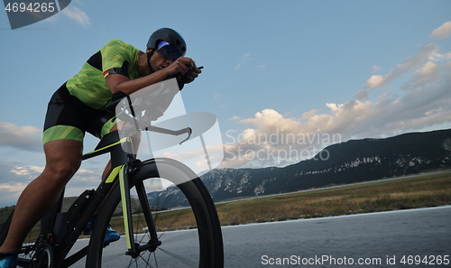 Image of triathlon athlete riding bike