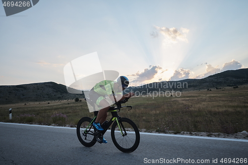 Image of triathlon athlete riding bike