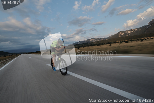 Image of triathlon athlete riding bike