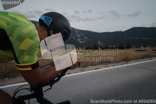 Image of triathlon athlete riding bike