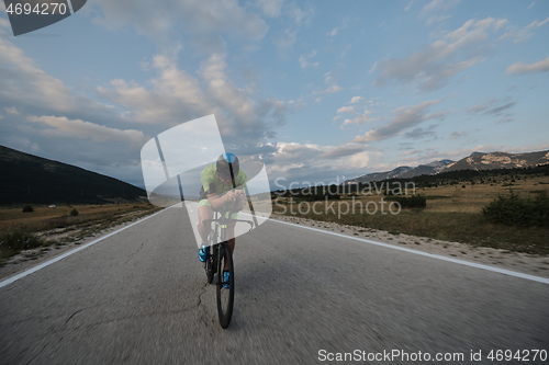 Image of triathlon athlete riding bike