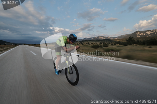 Image of triathlon athlete riding bike