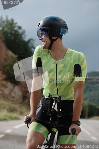 Image of triathlon athlete riding bike