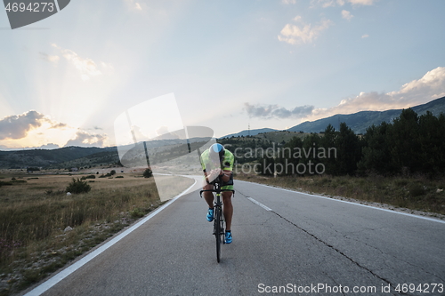 Image of triathlon athlete riding bike