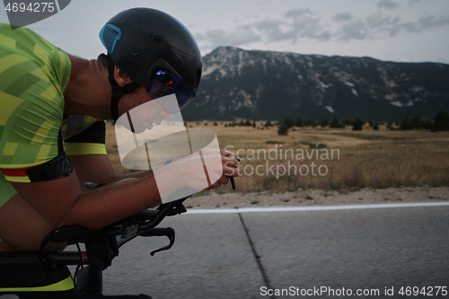 Image of triathlon athlete riding bike