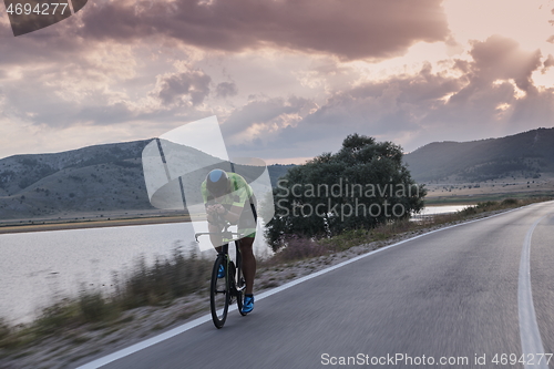 Image of triathlon athlete riding bike