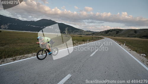 Image of triathlon athlete riding bike