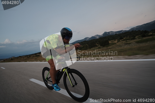 Image of triathlon athlete riding bike