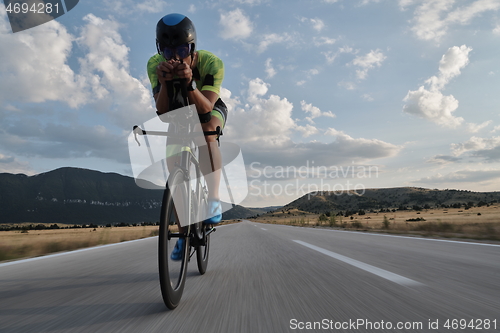 Image of triathlon athlete riding bike