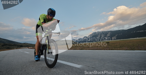 Image of triathlon athlete riding bike