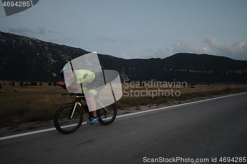 Image of triathlon athlete riding bike