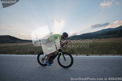 Image of triathlon athlete riding bike