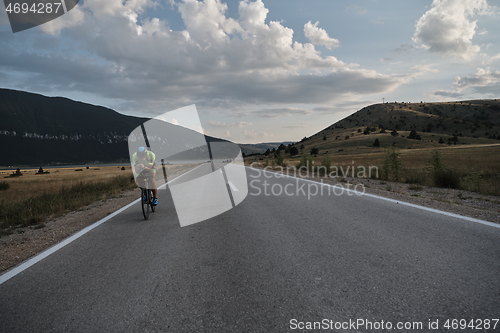 Image of triathlon athlete riding bike