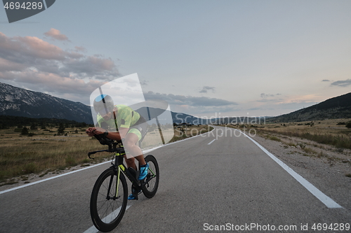 Image of triathlon athlete riding bike