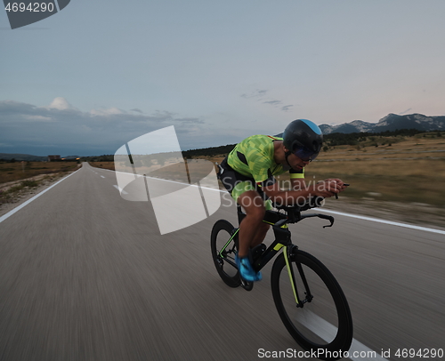 Image of triathlon athlete riding bike