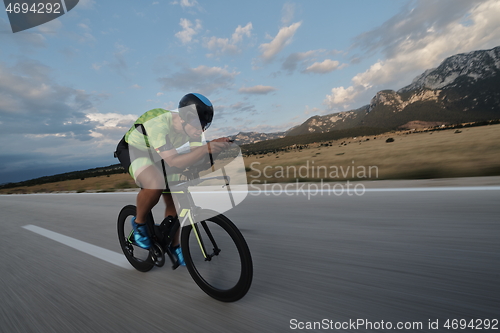 Image of triathlon athlete riding bike