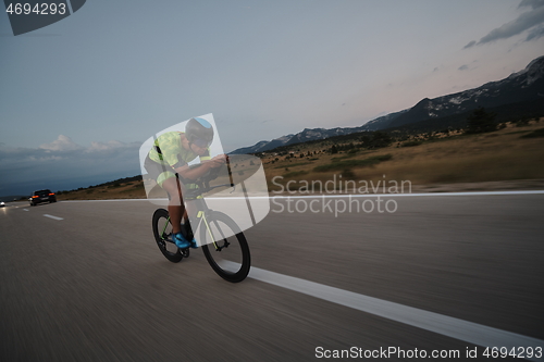 Image of triathlon athlete riding bike