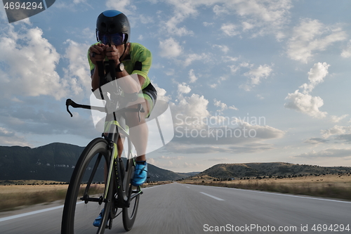 Image of triathlon athlete riding bike