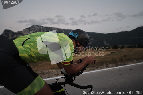 Image of triathlon athlete riding bike