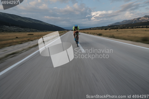 Image of triathlon athlete riding bike