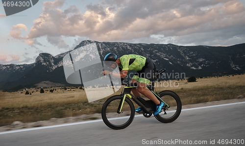 Image of triathlon athlete riding bike