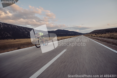 Image of triathlon athlete riding bike