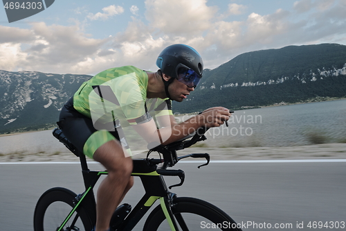 Image of triathlon athlete riding bike