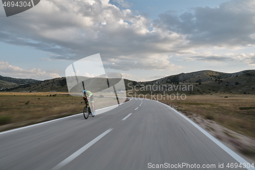 Image of triathlon athlete riding bike