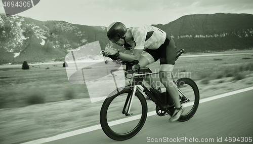 Image of triathlon athlete riding bike