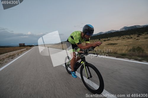 Image of triathlon athlete riding bike