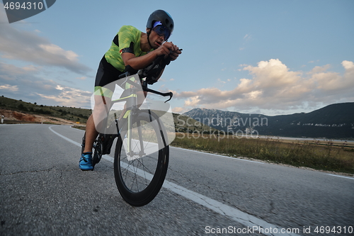 Image of triathlon athlete riding bike