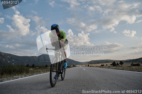 Image of triathlon athlete riding bike