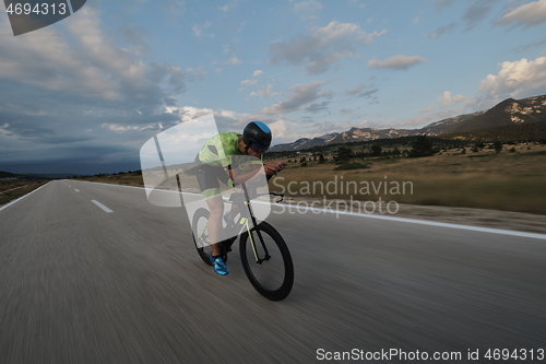 Image of triathlon athlete riding bike