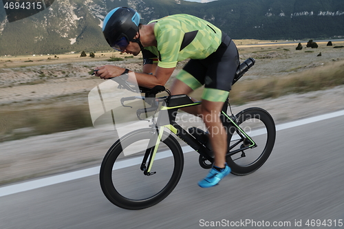 Image of triathlon athlete riding bike