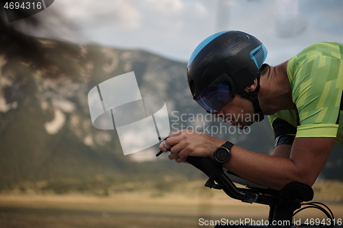 Image of triathlon athlete riding bike