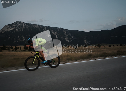 Image of triathlon athlete riding bike