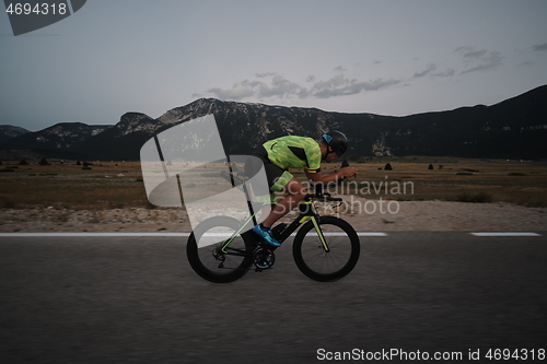 Image of triathlon athlete riding bike