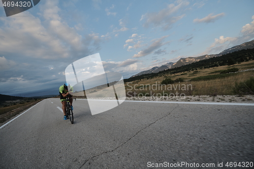 Image of triathlon athlete riding bike