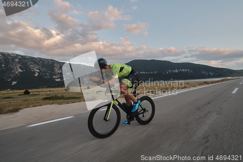 Image of triathlon athlete riding bike