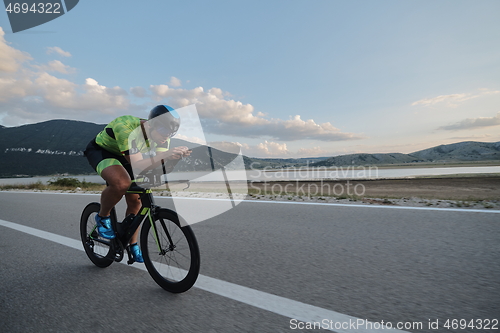 Image of triathlon athlete riding bike